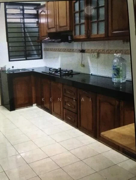 Kitchen features: brown wooden cabinetry, black granite countertop, built-in gas stove, double-bowl stainless-steel sink, white tiled backsplash, ceramic tile flooring, window with metal grille, water bottle on countertop, wooden table, kitchen utensils visible; style: traditional.