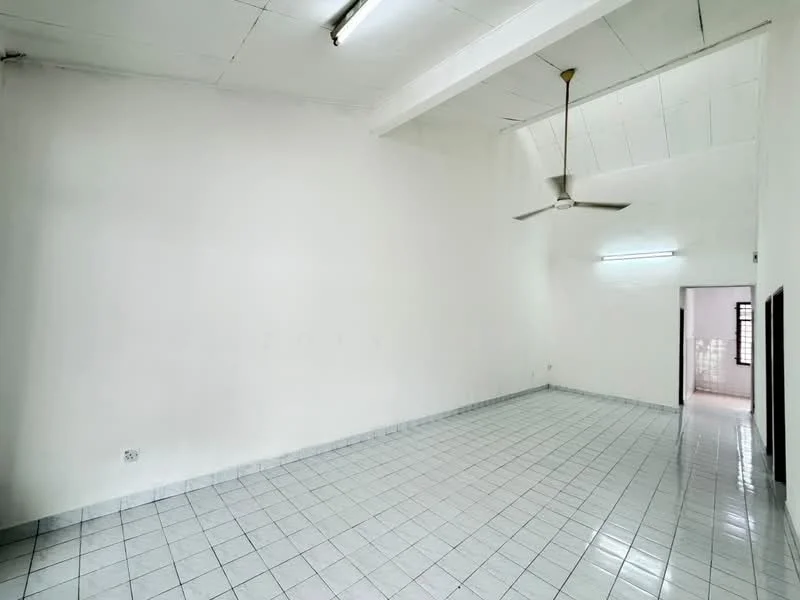 Room features: white painted walls, white tiled flooring, exposed beams on ceiling, ceiling fan, fluorescent lighting, open layout, large space, no visible furniture; style: minimalist.