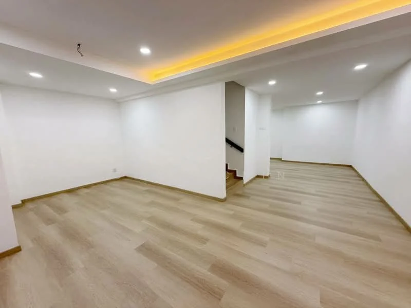 Room features: white painted walls, laminate flooring, recessed downlights, LED strip lighting, open layout, staircase visible in background; style: modern.
