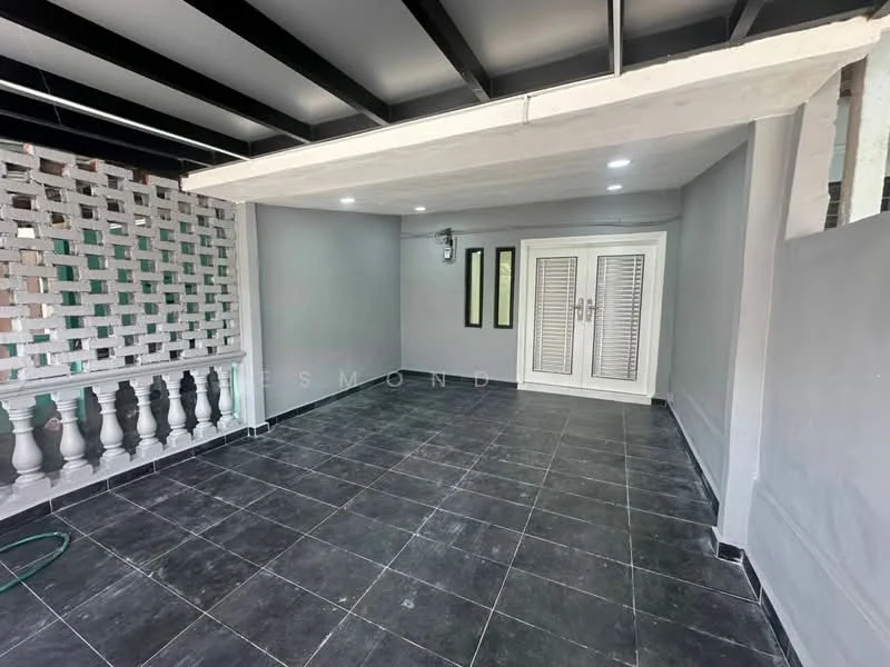 Room features: grey painted walls, black tiled flooring, exposed beam ceiling, wall-mounted light fixture, French doors, sliding windows, decorative wall with lattice design, balustrade, outdoor hose visible; style: modern.