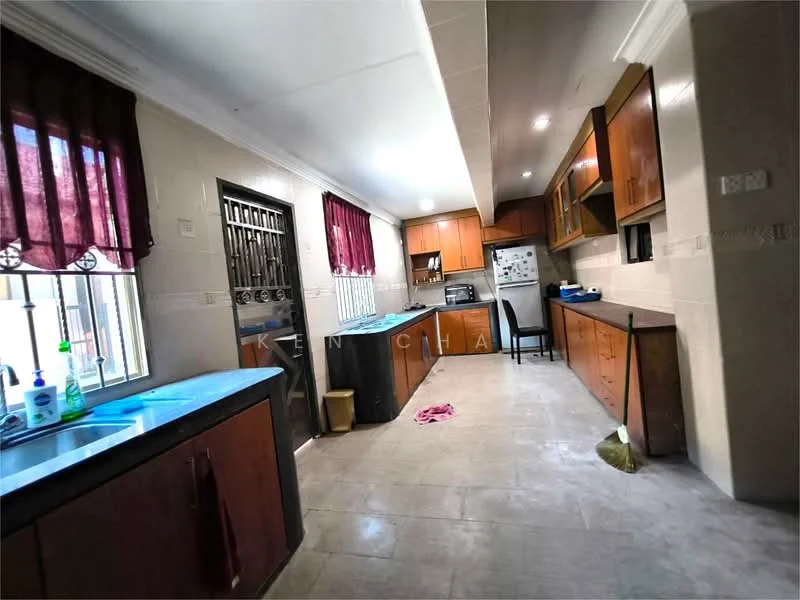 Kitchen features: blue granite countertop, single-bowl stainless-steel sink, chrome pull-down faucet, wood cabinetry with brown finish, built-in oven, freestanding range oven, refrigerator, ceramic tile flooring, white painted walls, window with metal grille, red sheer curtains, broom, cleaning cloth on floor; style: modern.
