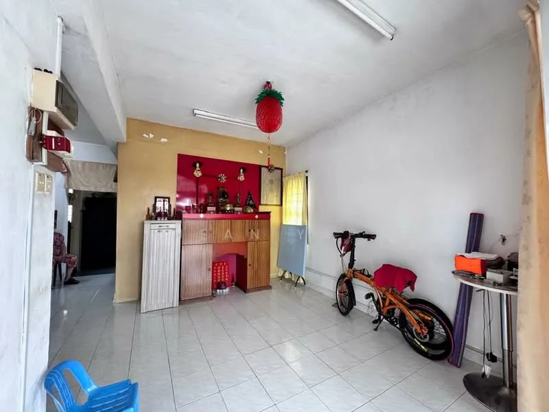 Living features: white painted walls, tile flooring, recessed ceiling lights, bar counter with red accent wall, decorative shelves, window with sheer curtains, bicycle, blue plastic chair.