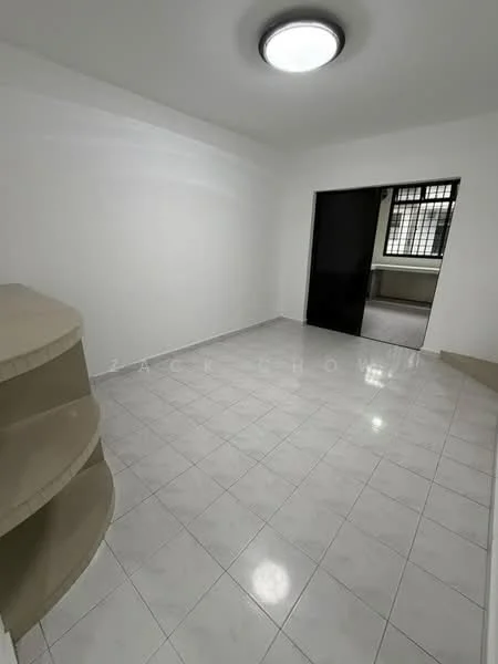 Room features: white painted walls, white tiled flooring, ceiling light fixture, corner shelving unit, large window with grid pattern, doorway leading to another room.