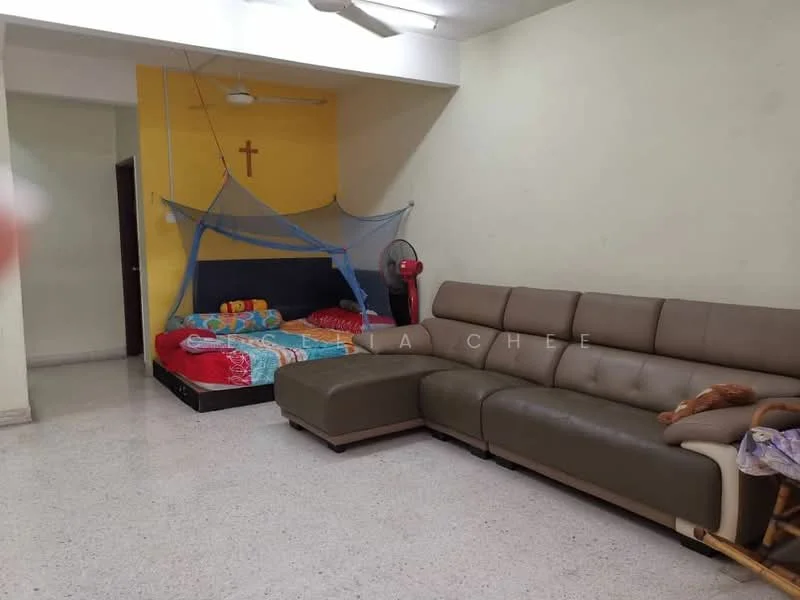 Living features: 3-seater sectional sofa in beige, colorful bedspread on bed, mosquito net over bed, ceiling fan, wall-mounted cross, tile flooring, decorative wall, standing fan.