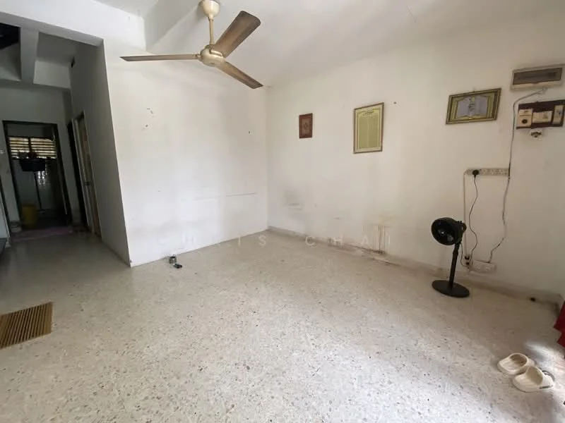Living features: white painted walls, ceiling fan, terrazzo flooring, wall-mounted electrical outlets, framed artwork, floor vent, sliding door access to another room, light switch.