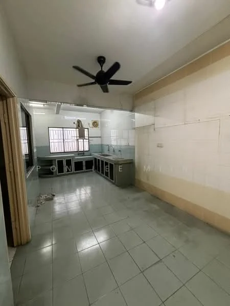 Kitchen features: grey tiled flooring, white painted walls, ceiling fan, kitchen cabinets with black finish, countertop with grey surface, double-bowl stainless-steel sink, wall-mounted shelves, window for natural light, open layout, light fixture on ceiling.