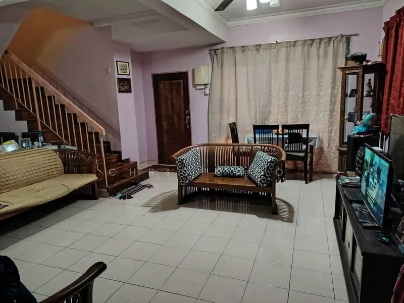 Living features: cream painted walls, white ceiling, ceiling fan, 3-seater rattan sofa, wooden coffee table, TV console, wall-mounted TV, dining table with chairs, curtains, tile flooring, staircase in background, decorative items on shelves; style: traditional.