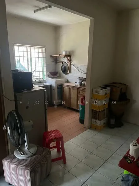 Kitchen features: wood cabinetry, stainless-steel sink, wall-mounted shelves, tile backsplash, countertop, window with grid design, ceramic tile flooring, refrigerator, washing machine, fan, plastic stool, storage boxes.