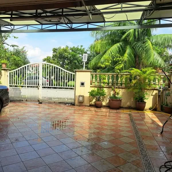 Exterior type: car porch; features: tiled flooring with decorative border, manicured landscaping with potted plants, metal gate, covered car porch, palm trees, open sky view, fenced perimeter, brick wall, driveway with interlocking pavers; style: modern.