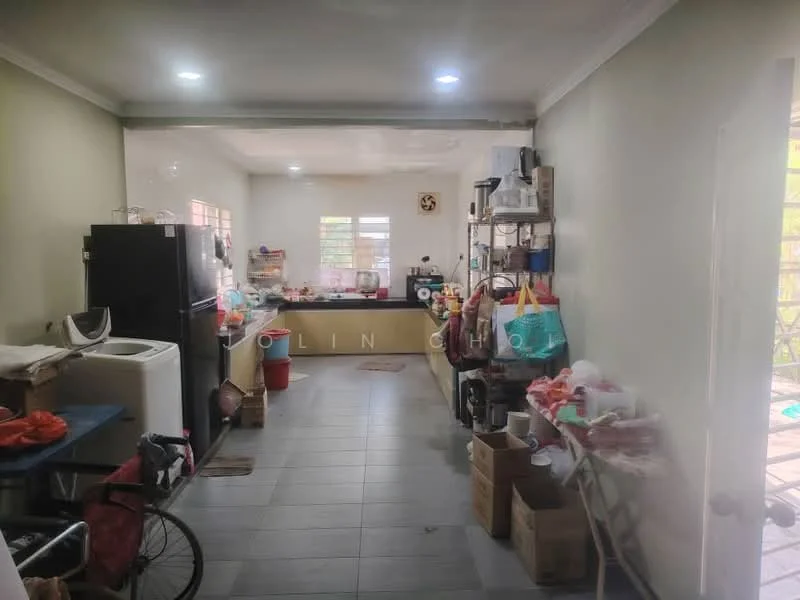 Kitchen features: grey tiled flooring, white painted walls, recessed downlights, black refrigerator, white washing machine, wooden countertop, open shelving, various kitchen appliances, multiple storage boxes, kitchen sink, window with natural light, dining area with chairs.