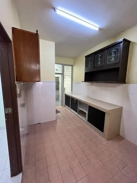 Kitchen features: pink tiled flooring, cream painted walls, wooden upper cabinets, dark wood lower cabinets, countertop with storage underneath, window for natural light, fluorescent ceiling light, open layout.