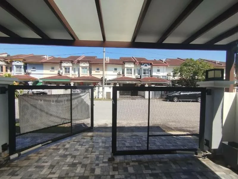 Exterior type: linked terrace house; features: metal gate, paved driveway, surrounding residential area, two-storey houses in background, clear blue sky, fenced perimeter; style: modern.