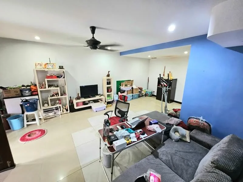 Living features: grey fabric sofa, coffee table, TV console, wall-mounted TV, 5-blade ceiling fan, white painted walls, blue accent wall, tile flooring, decorative rug, open shelving unit, storage boxes, exercise equipment; style: modern.
