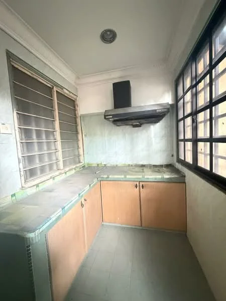 Kitchen features: green tiled countertop, wood cabinetry, built-in kitchen hood, single-bowl stainless-steel sink, grey tiled flooring, sliding window with metal grills, wall-mounted light fixture, crown moulding.