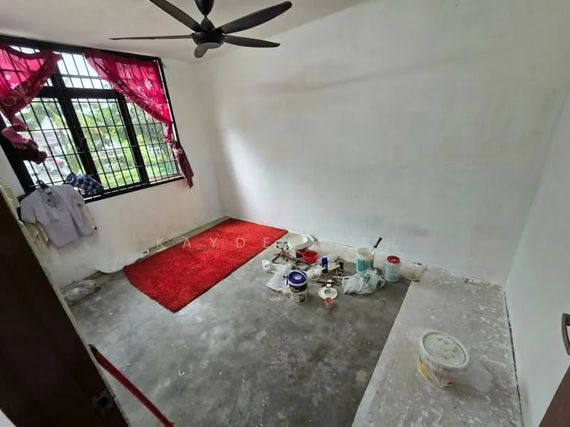 Room features: white painted walls, concrete flooring, 5-blade ceiling fan, floor-to-ceiling windows, red curtains, red area rug, paint cans and tools visible; style: minimalist; view: garden.