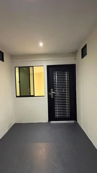 Room features: white painted walls, grey flooring, black security door, glass windows, recessed lighting; style: modern.