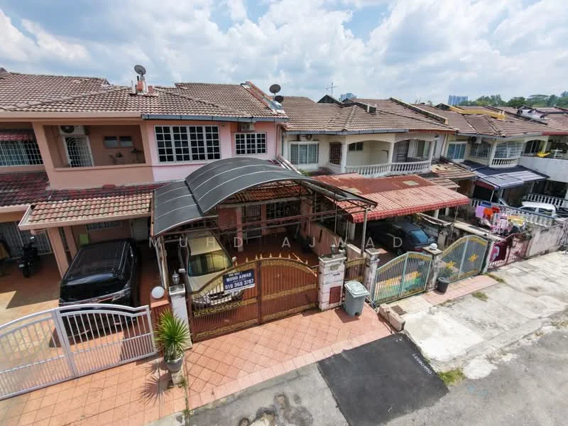 Exterior type: linked terrace house; features: red brick facade, flat roof, car porch with awning, manicured lawn, paved walkway, multiple parking spaces, surrounded by residential buildings, security gate at entrance; style: modern.