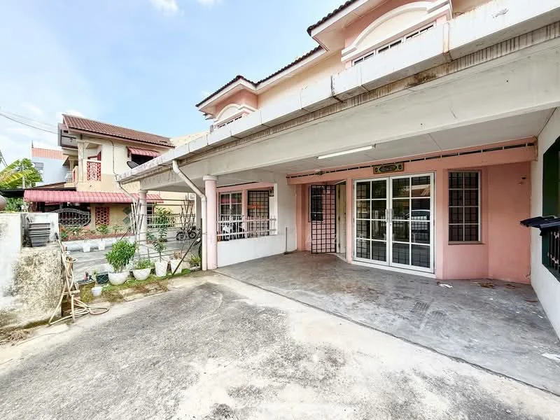 Exterior type: linked terrace house; features: covered car porch, concrete flooring, pink painted facade, white window frames, security grilles on windows, manicured garden with potted plants, single-storey, adjacent to other linked terrace houses; style: modern.