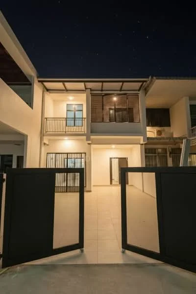 Exterior type: semi-detached house; features: two-storey structure, white painted facade, glass sliding doors, balcony with railing, covered porch area, tiled flooring, modern design, outdoor lighting, gated entrance, large windows, open space in front; style: modern.