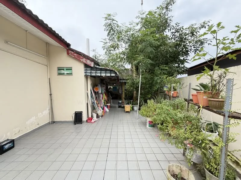 Exterior features: tiled flooring, potted plants, garden area, storage area with tools, overhead roof, fenced perimeter, greenery, outdoor space.