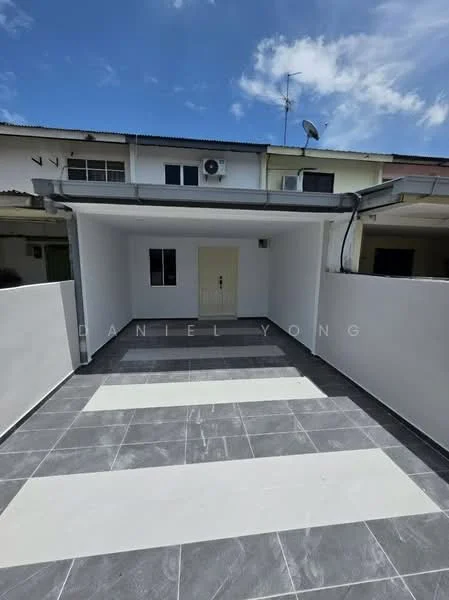 Exterior type: linked terrace house; features: paved driveway with grey and white tiles, covered car porch, white painted walls, single door entrance, window visible on the side wall, satellite dish on the roof, air conditioning unit mounted on the wall, clear blue sky in background; style: modern.