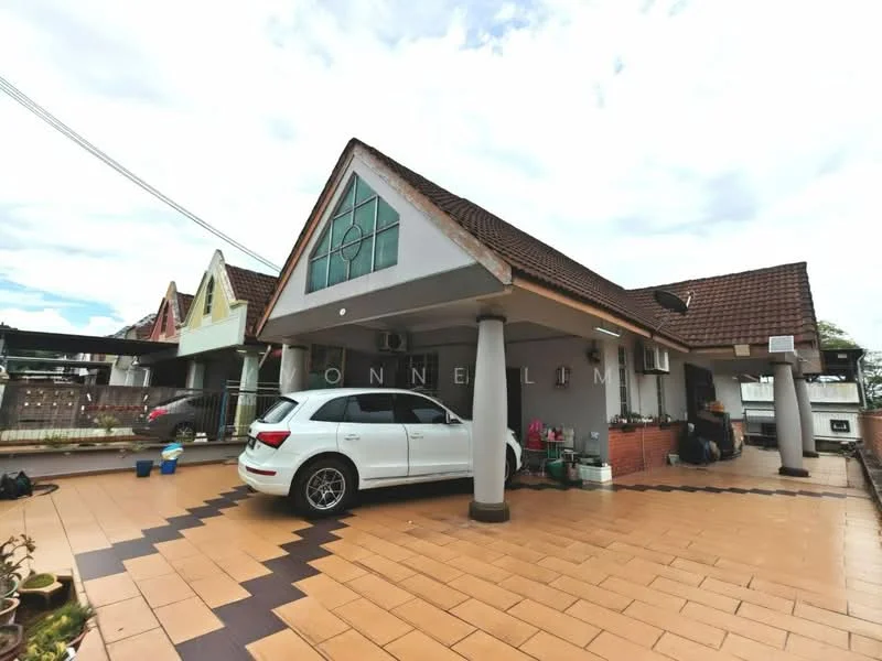 Exterior type: semi-detached house; features: pitched tile roof, cream painted facade, decorative gable window, exposed brick accents, front porch with columns, driveway with interlocking pavers, landscaped garden area, multiple air conditioning units visible, parking space for 1 car; style: modern.