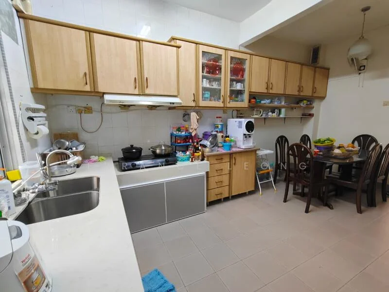 Kitchen features: laminate cabinetry in light wood, white tiled walls, grey tiled flooring, double-bowl stainless-steel sink, chrome pull-down faucet, built-in oven, freestanding gas stove, microwave, kitchen island with storage, dining table with four chairs, various kitchen appliances on countertop, open shelving with glassware, decorative fruit bowl; style: modern.