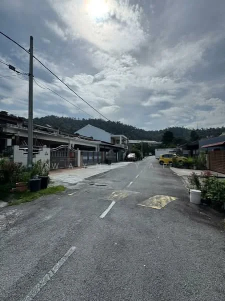 Exterior features: residential street, asphalt road, overhead power lines, surrounding hills, cloudy sky, paved walkway, landscaped gardens, parked vehicles.