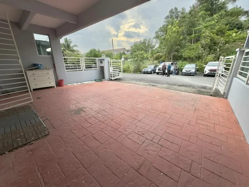 Exterior features: paved driveway, open-air parking lot, surrounded by greenery, metal gate, concrete walls, sliding gate, single-storey structure, partially covered area; style: modern.