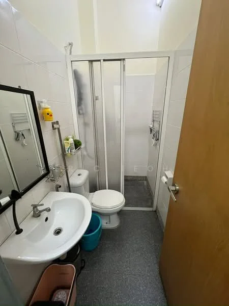 Bathroom features: white tiled walls, grey floor tiles, single-sink vanity with chrome faucet, framed mirror, toilet, walk-in shower with glass enclosure, shower head, soap dispenser, toilet paper holder, small storage shelf, waste bin; style: modern.
