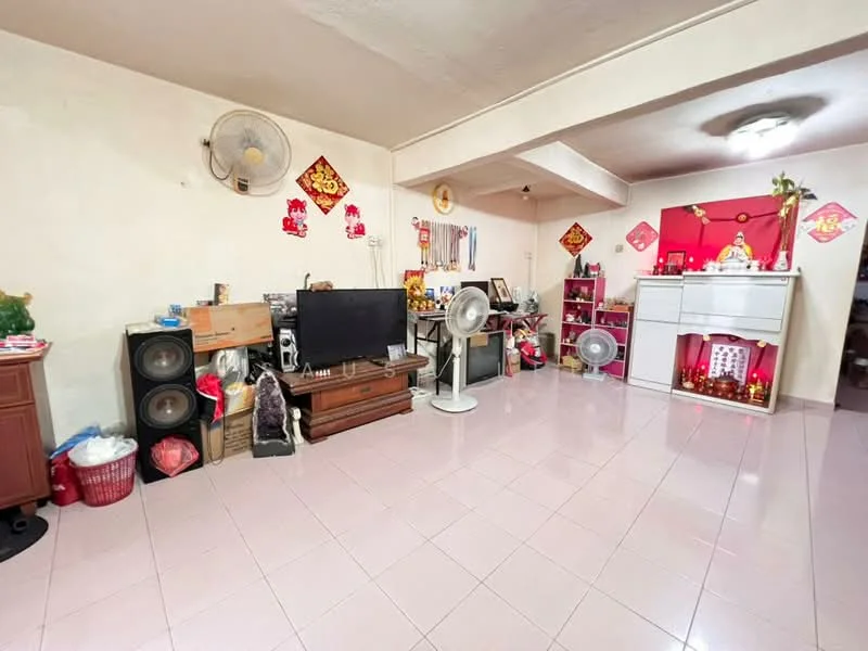 Living features: light pink tiled flooring, white painted walls, ceiling fan, wall-mounted TV, wooden TV console, decorative altar with offerings, multiple standing fans, shelves with decorative items, storage cabinets, framed artwork, red decorative banners, open layout; style: traditional.