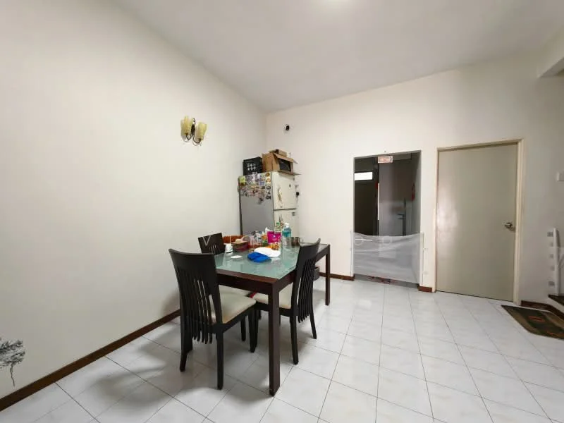Dining features: dining table with four chairs, white tiled flooring, cream painted walls, refrigerator, wooden door, wall-mounted light fixture, open layout to kitchen, window with sheer curtains.