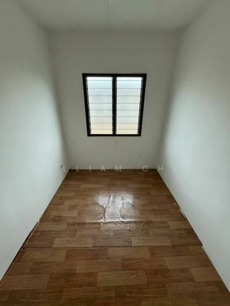 Room features: white painted walls, wooden flooring, single window with horizontal slats.