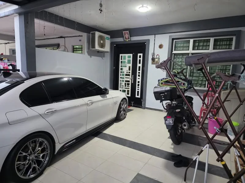 Room features: white tiled flooring, grey walls, wall-mounted split AC, black front door with decorative panel, large windows with green frames, ceiling light fixture, motorbike, white car, clothes drying rack, bicycle, decorative wall art; style: modern.