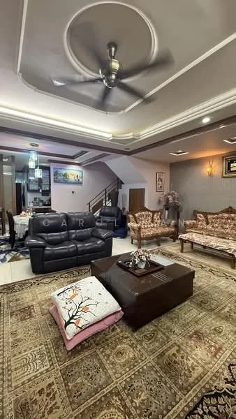 Living features: 5-blade ceiling fan with light, 3-seater leather sofa in black, 2-seater fabric sofa with floral pattern, coffee table with dark wood finish, area rug with intricate pattern, wall-mounted TV, decorative wall art, recessed downlights, crown moulding on ceiling, staircase visible in background; style: contemporary.