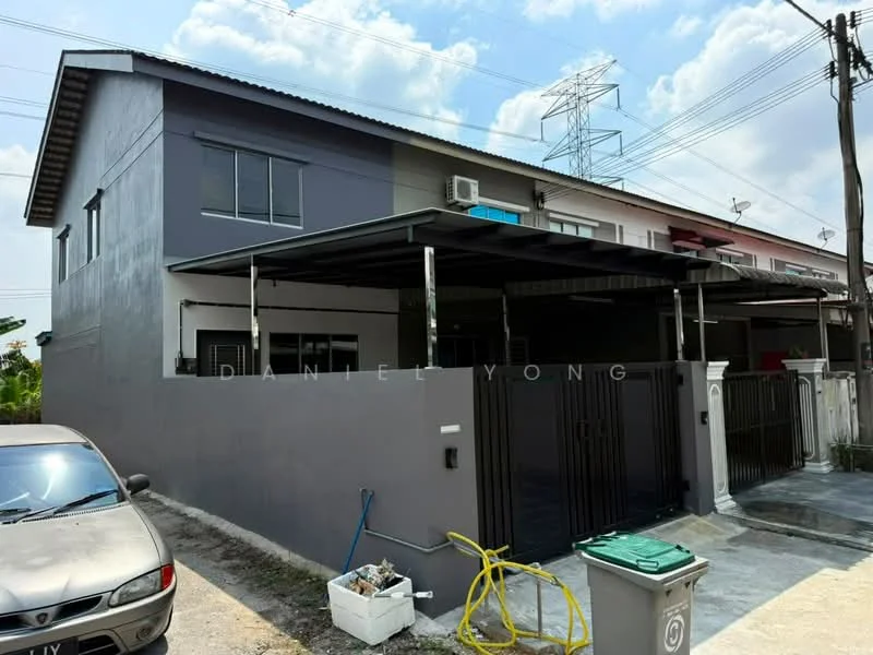 Exterior type: semi-detached house; features: grey painted facade, flat roof, car porch with awning, black metal gate, driveway with interlocking pavers, air conditioning unit visible, surrounded by greenery, front yard area; style: modern.