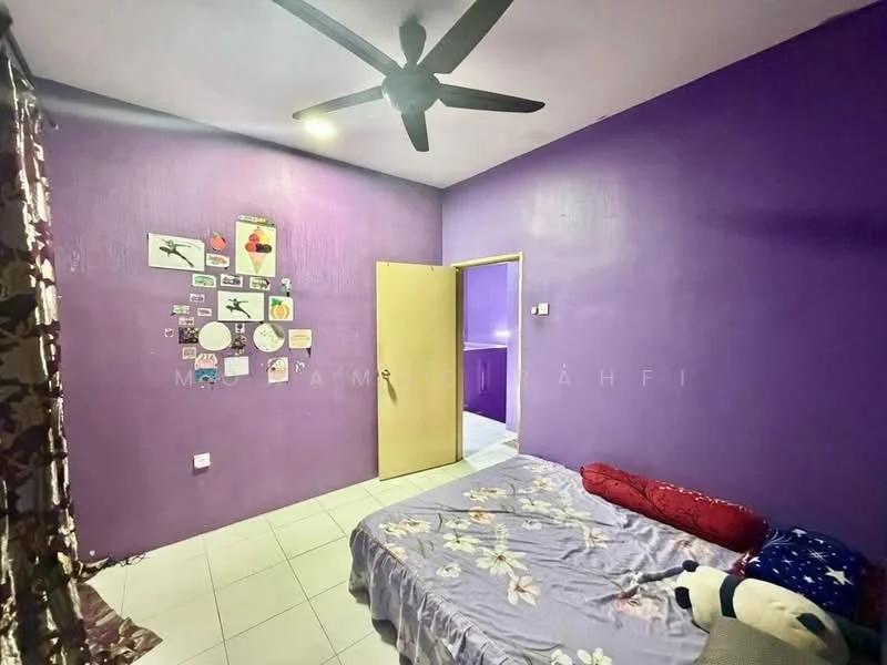 Bedroom features: purple painted walls, white tiled flooring, 5-blade ceiling fan, double bed with floral bedding, red decorative pillows, wall-mounted artwork, curtains with floral pattern, built-in wardrobe with door.