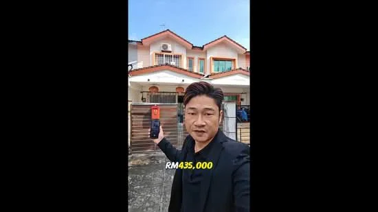Exterior type: semi-detached house; features: two-storey structure, red tiled roof, cream painted facade, front porch, metal gate, balcony with railing, multiple windows, air conditioning unit visible, driveway, landscaped front yard; style: modern.