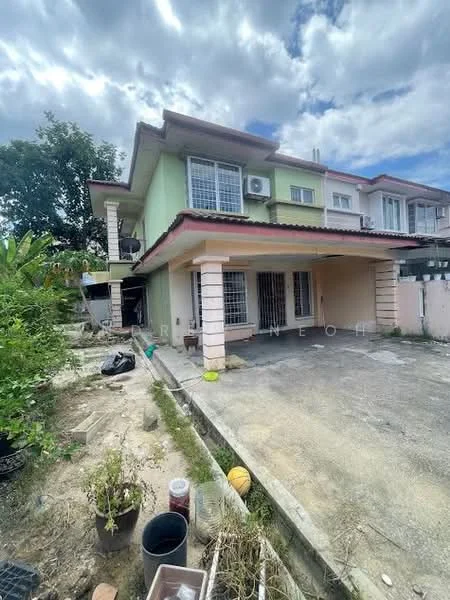 Exterior type: semi-detached house; features: two-storey structure, green painted facade, red tiled roof, front porch, driveway, manicured garden area, visible air conditioning unit, fenced perimeter, paved walkway, outdoor plants, garage space; style: modern.