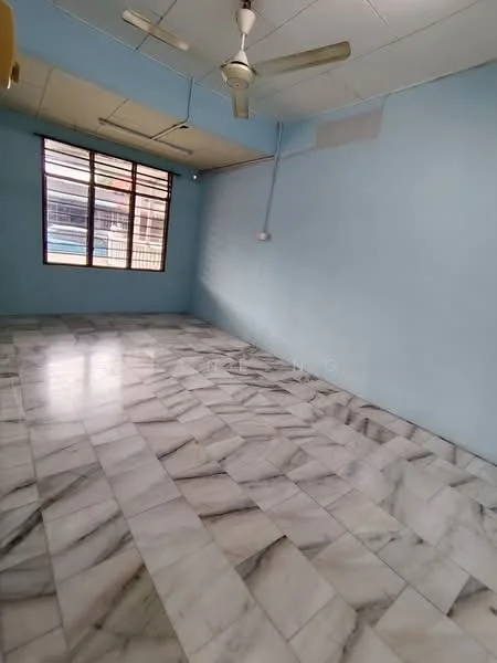 Room features: light blue painted walls, marble tile flooring, ceiling fan, large window, natural light, no visible furniture.