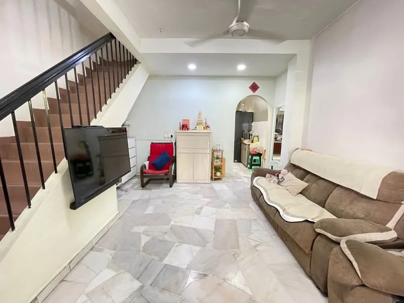 Living features: marble flooring, white painted walls, ceiling fan, 3-seater fabric sofa in brown, TV mounted on wall, wooden coffee table, decorative items on console, staircase with black railing, arched doorway leading to kitchen, green chair, red decorative item on wall; style: modern.