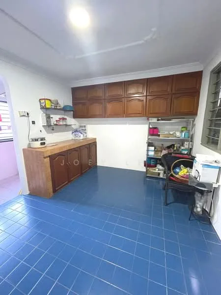 Kitchen features: blue ceramic tile flooring, white painted walls, wooden cabinetry with brown finish, wooden countertop, open shelving, sink, microwave, refrigerator, kitchen utensils on countertop, storage shelves, window with metal grilles.