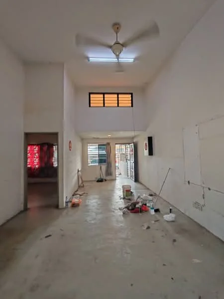 Room features: white painted walls, concrete flooring, ceiling fan, recessed lighting, large windows, door leading outside, unfinished space with tools and materials, high ceiling; style: minimalist.
