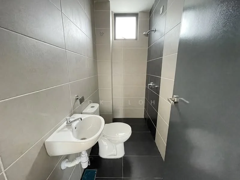 Bathroom features: grey tiled walls, white ceramic sink, chrome basin mixer faucet, white toilet, black tiled flooring, window for natural light, wall-mounted towel rail, mirror above sink; style: modern.