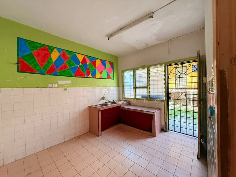 Kitchen features: green painted walls, white tiled walls, pink tiled flooring, single-bowl sink, red cabinetry, large window, sliding glass door, colorful geometric wall art, countertop space, open layout; view: garden.