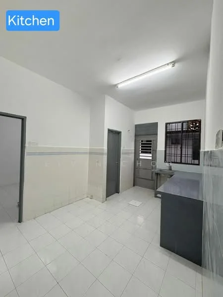 Kitchen features: white painted walls, glossy white tile flooring, single-bowl stainless-steel sink, grey countertop, built-in cabinetry, window with security bars, door leading outside, fluorescent ceiling lights; style: modern.