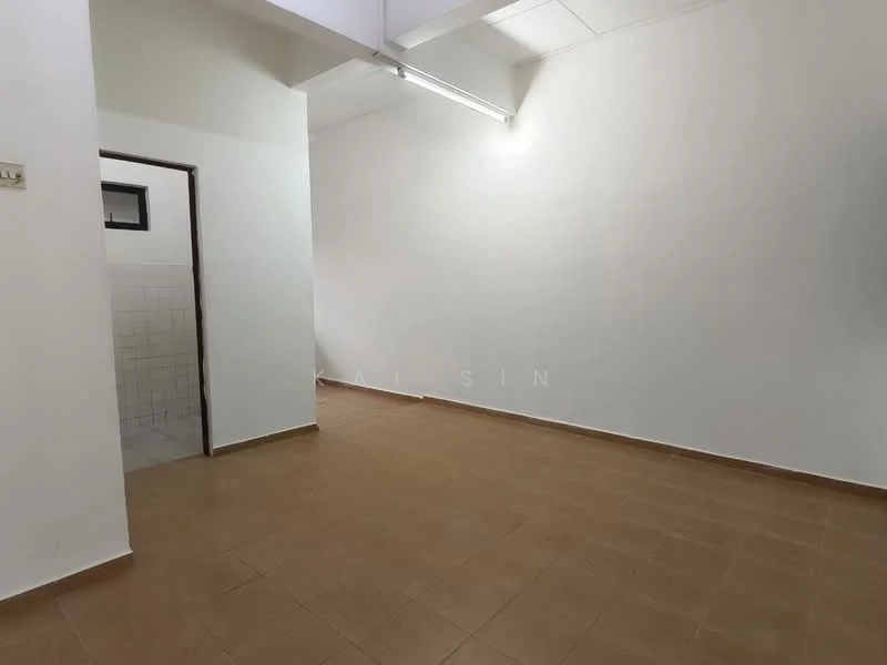 Room features: white painted walls, tile flooring, ceiling with fluorescent lighting, doorway leading to another room, empty space; style: minimalist.