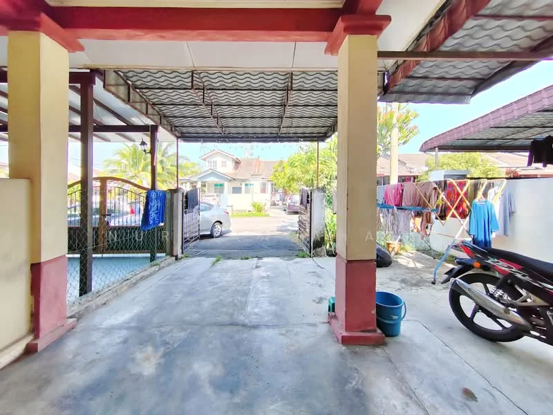 Exterior type: linked terrace house; features: covered car porch, concrete flooring, metal roof, fenced perimeter, laundry area with hanging clothes, driveway, garden area visible, adjacent street view, motorcycle parked, vehicle visible in driveway; style: modern.