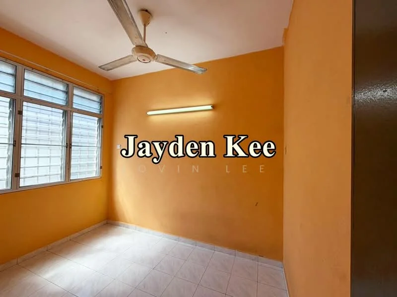 Room features: orange painted walls, white tiled flooring, ceiling fan, large windows with metal frames, natural light from windows, light fixture on wall.