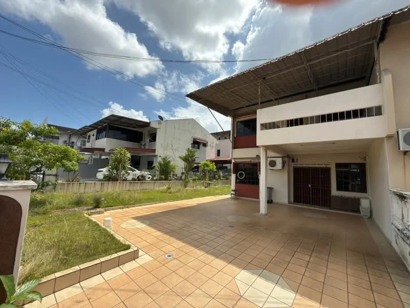 Exterior type: semi-detached house; features: tiled driveway, manicured lawn, surrounding greenery, two-storey structure, flat roof, visible air conditioning units, fenced perimeter, outdoor lighting, paved walkway; style: modern.